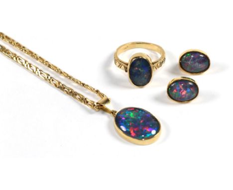 An opal triplet ring, stamped 'K18', finger size Q1/2, an opal triplet pendant, stamped 'K18' on chain, stamped '585', pendan