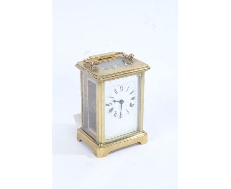 20th century brass cased carriage clock, the enamel dial with black roman numerals, with key, 11cm high excluding handle