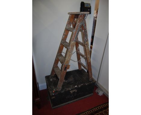 A late 19th century stained pine hinge top tool chest, with various stencilled text and iron end carry handles, width 87cm, t