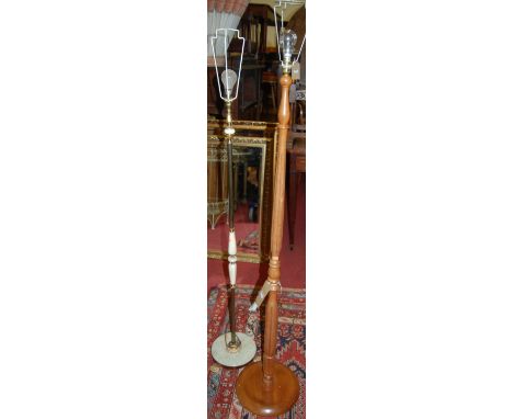 A modern beech turned standard lamp, together with an onyx and brass example (2)