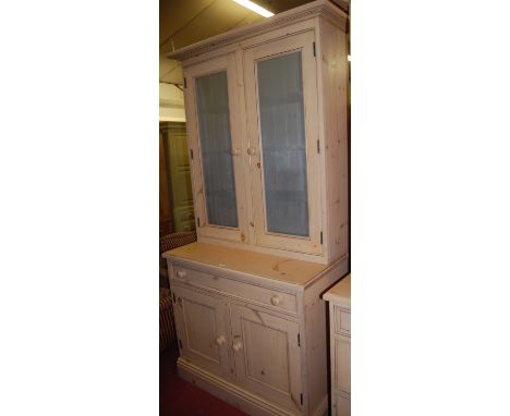 A Victorian style limed pine dresser, having twin pierced metal inset upper doors, over base with single frieze drawer to con