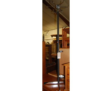 A 1970s chrome and black enamel hat stand, having six angular stepped hooks and raised on X-frame base, height 168cm