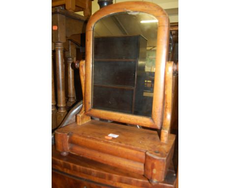 A 19th century oak circular pedestal tripod table, together with a Victorian mahogany swing toilet mirror (2)