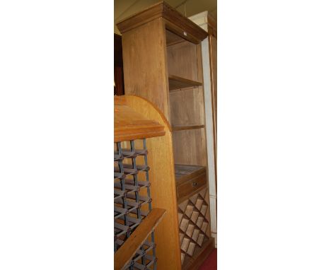 A contemporary elm freestanding open display shelf, having single lower drawer over removable wine rack with capacity for 12 