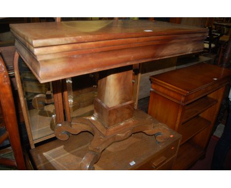 An early Victorian mahogany fold over card table having a revolving action, width 87cm