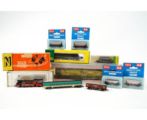 A Piko N gauge locomotive, boxed, A Minitrix locomotive boxed, a Minitrix tender boxed, five Peco N gauge Wagons, boxed and a