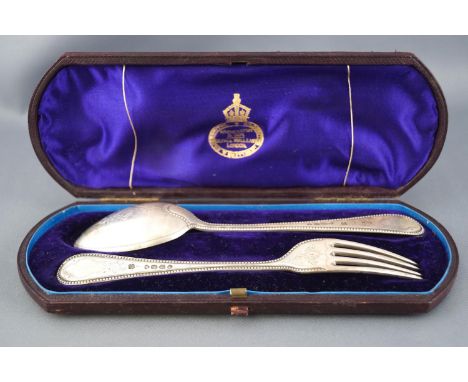 A child's cased silver bead edge pattern dessert spoon and fork, with stipple engraved highlights, London 1874, the spoon 16c
