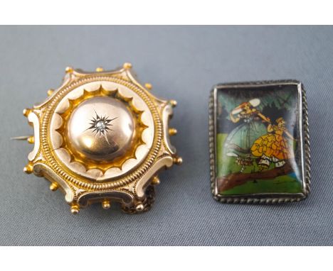 A collection of two brooches to include a base metal mourning brooch set with a rose cut diamond and a stamped 'sterling' pai