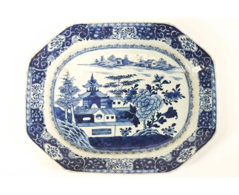 A blue &amp; white octagonal Chinese porcelain export plate, decorated with a scene of a house and peonies in a landscape, in