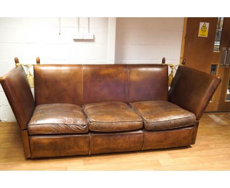 A brown leather Knowle sofa with three loose cushions, from Leather chairs of Bath, 101cm high x 242cm wide x 94cm deep