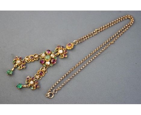 A yellow metal abstract pendant set with rhodolite garnets, cabochon emeralds and rice pearls (NB: Stones untested for natura