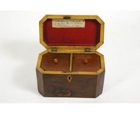 A George III yew wood shaped rectangular tea caddy, the interior labelled " This caddy belonged to my dear husband's mother M