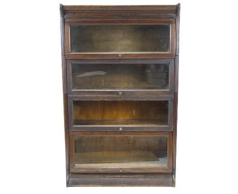 An oak Globe Wernick style four tier bookcase, 142cm high x 87cm wide x 33cm deep