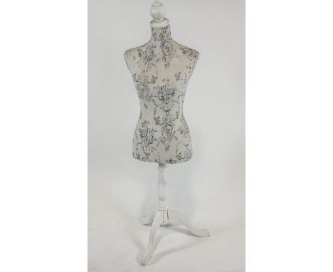 A dress makers mannequin on turned stem and triform base, 131cm high
