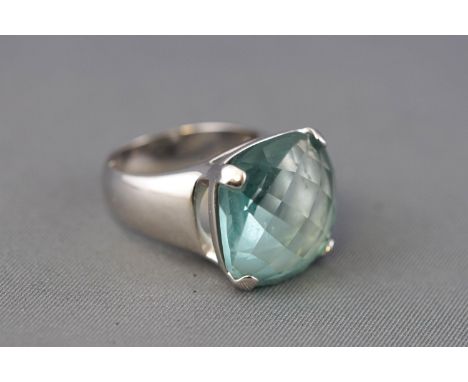 A Swarovski ring, set with a cushion shaped facet cut clear aquamarine coloured crystal