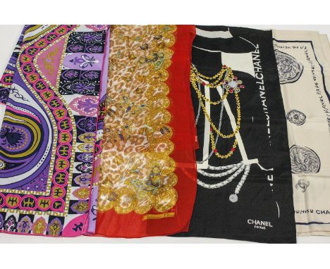 Two Chanel silk scarves, a Christian Dior scarf and another (4)