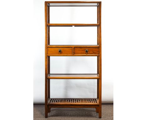 A set of Chinese hardwood shelves with twin central drawers and geometric pieced base shelf, 178cm high x 83cm wide x 39cm de