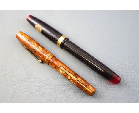 Two vintage Waterman fountain pens, a 'Hundred Year Pen' and a 'Skywriter'