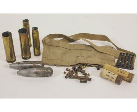 A group of assorted brass ammunition, in the form of spent shell cases and cartridges, 29cm high
