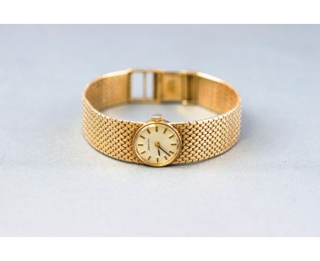 A yellow metal wristwatch by Zenith. 17 Jewelled manual wind movement, signed Zenith. Circular case with silver dial and bato