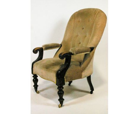 A 19th century mahogany armchair with padded back over scroll arms, with turned legs on ceramic casters, 102cm high x 66cm wi