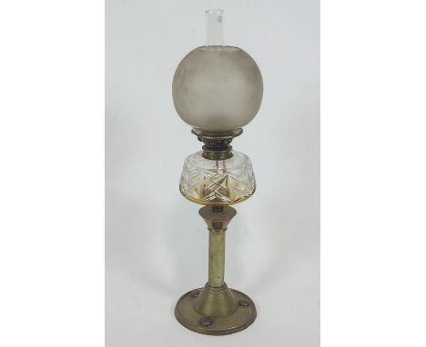 A Victorian brass oil lamp with cut glass reservoir, 65cm high