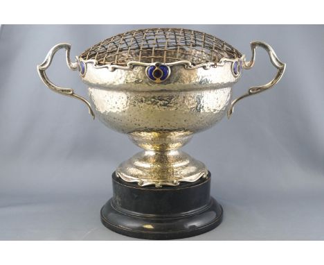 A silver plated two handled rose bowl on a plinth, of Art Nouveau form with a spot hammered finish, the shaped rims set with 