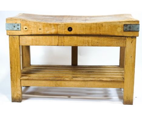 A pine butcher's block, the scrubbed top with usual signs of wear, on square section supports and base shelf 82cm high x 122c