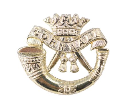 A Duke of Cornwall's Light Infantry white metal cap badge, stamped silver and tested as such