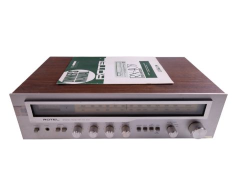 A Rotel RX-403 stereo AM/FM receiver, with owner's manual, 47 x 27.5 x 12 cm