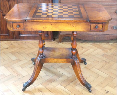 A late 20th Century burr veneered games table, having four drawers and a sliding double sided top respectively finished with 