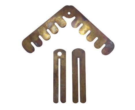 A pre-Great-War White's patent military clothing protector by Jennens &amp; Co, together with two other brass button sticks