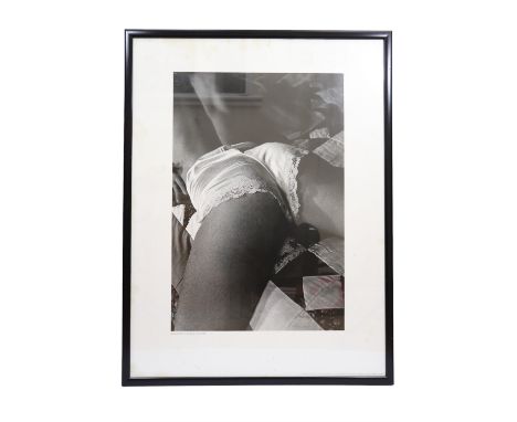 After Jeanloup Sieff (French, 1933 - 2000) "Petite culotte", an erotic portrayal of a woman lying on a bed, print, dated 1981