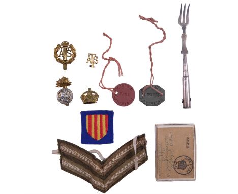 Sundry items of militaria including a Great War Arras "trench art" pickle fork, cap badges and identity discs etc