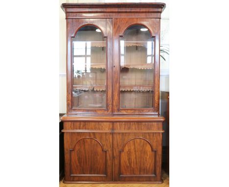 A William IV glazed mahogany cabinet bookcase, having tooled leather shelf aprons, 130 x 53 x 224 cm