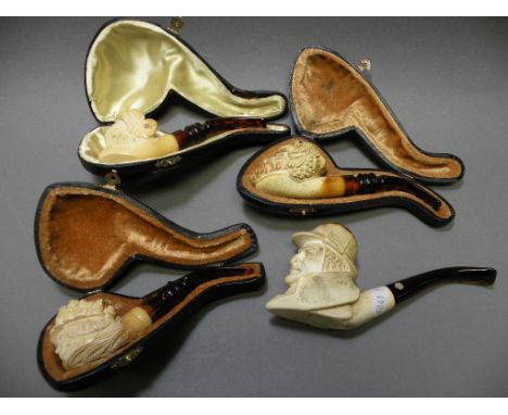 Three Cased Meerschaum Pipes and another Pipe