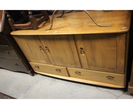 Ercol Pale Elm Sideboard with three cupboards over two drawers