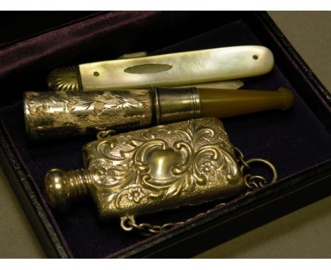 Cigarette Holder with Silver Band, Mother of Pearl Fruit Knife with Silver Blade and a White Metal Scent Bottle