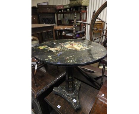 19th century Black Lacquered Table with circular top, pedestal support and platform base with three castors decorated with pa