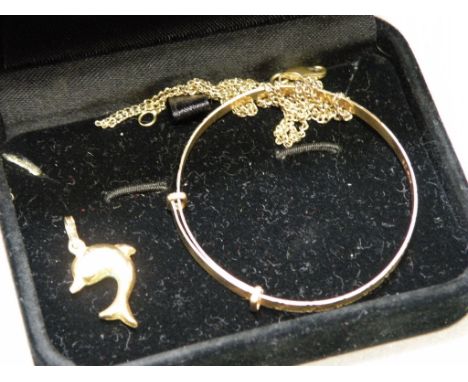 9ct Gold Child's Bangle, 9ct Gold Dolphin Charm and an 18k Gold Chain