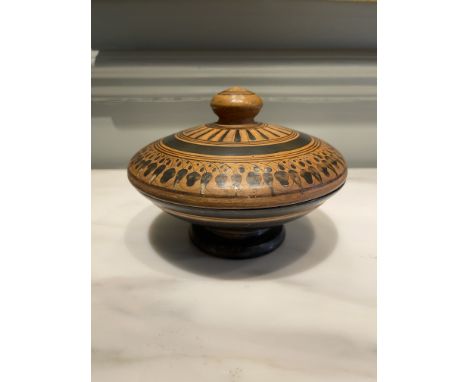 A rare Colonial Greek or Etruscan pyxis with a black figure lid. The rarity of the item is due in part to the survival of the