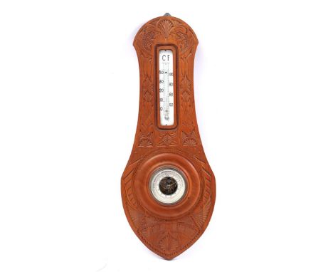 Teak wood barometer with carved decoration, 62 cm high