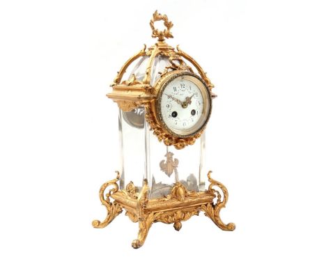 Lantern model table clock, movement with enamel dial in crystal case, set in gold-coloured zamak frame, in Louis Quinze style