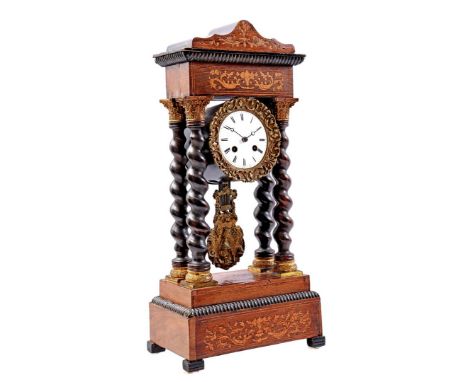Column mantel clock in a walnut veneer case with marquetry decoration, twisted columns and an image of a lady on a pendulum, 
