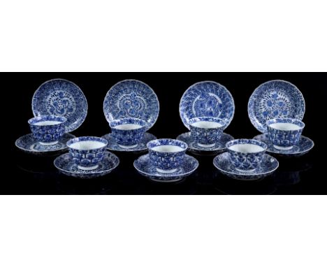 8 porcelain cups and 11 saucers with contoured rim and blue and white floral decor, marked on the back, China 19th century (v