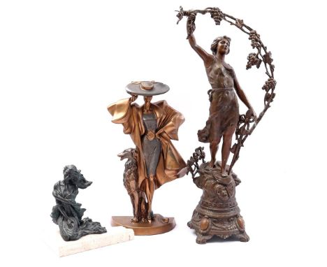 2 plastic statues of women w.o. 1 with dog and on the reverse 'Austin sculpture Danel 1994', and a zamak sculpture of a woman