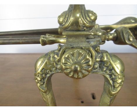Antique brass fire dogs with tools 