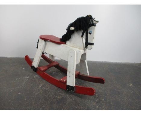 Vintage wooden child's rocking horse. H67 x L93 x W30. 