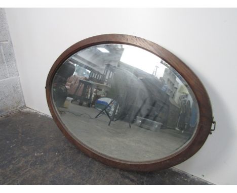 1930's bevelled mirror oval mirror. 77 x 51cms. 