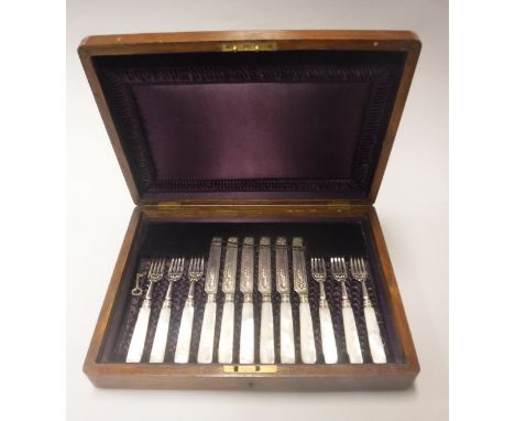 A mahogany cased set of late Victorian silver mounted mother of pearl handled fruit knives and forks (by Joseph Rogers &amp; 